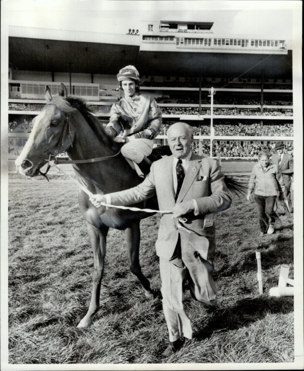 E.P. Taylor is shown in October 1973 leading Lord Durham, with jockey Sandy Hawley, to the winner's circle at Woodbine. - Ron Bull/Toronto Star file photo