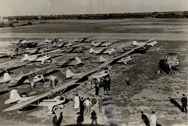 This fleet of small airplanes flew over Toronto in September 1938 and landed at North York's Barker Field so that their pilots could visit the CNE. This photograph is taken prior to take-off in Hamilton. - Toronto Star file photo